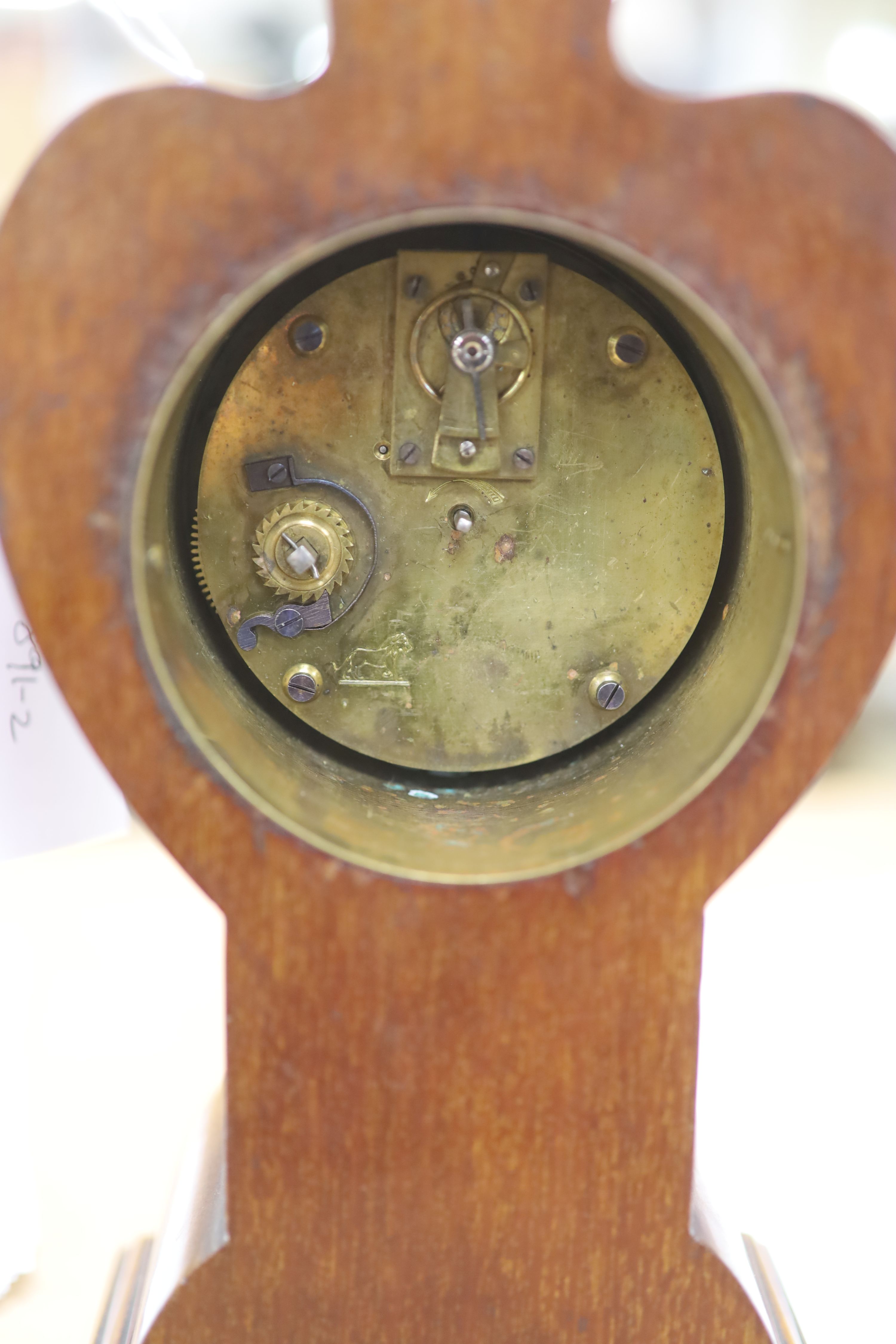 A French Art Nouveau mahogany and marquetry mantel timepiece, height 26cm
